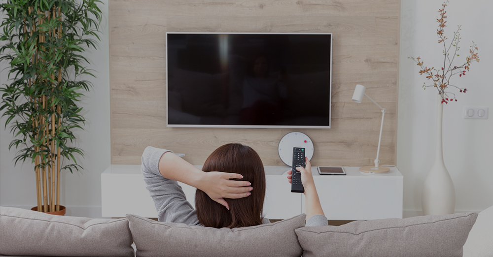 Woman watches a television